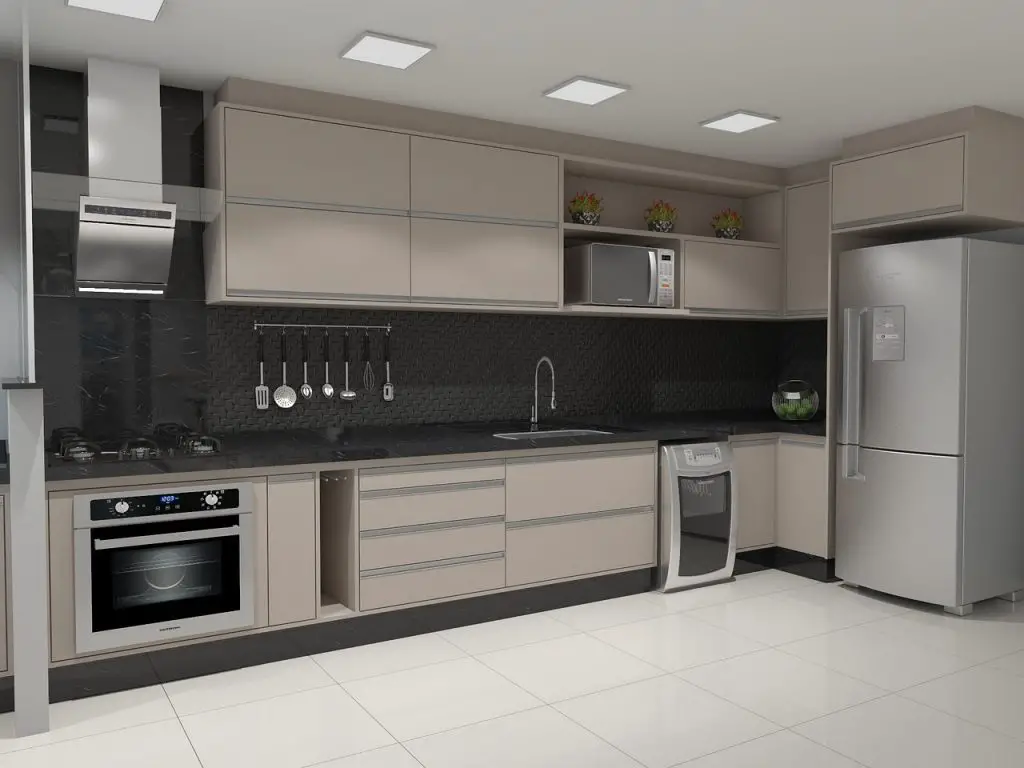 Image of a kitchen with black counter top, a stove, and a range hood above it. Source: kitchen, pixabay