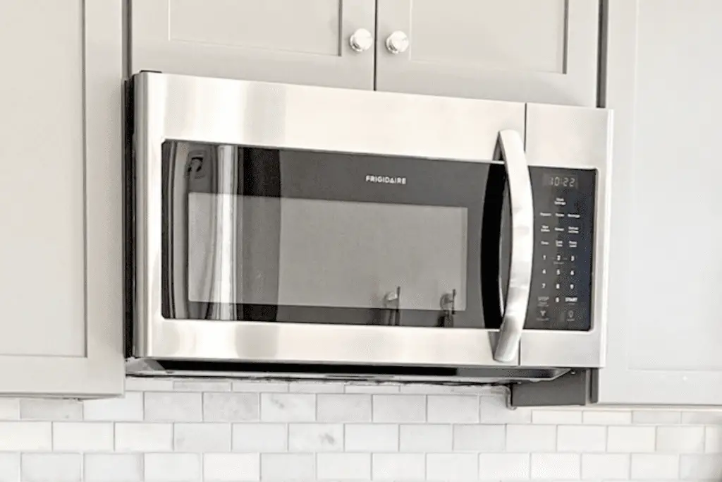 Image of a microwave oven over a range. Source: Unsplash