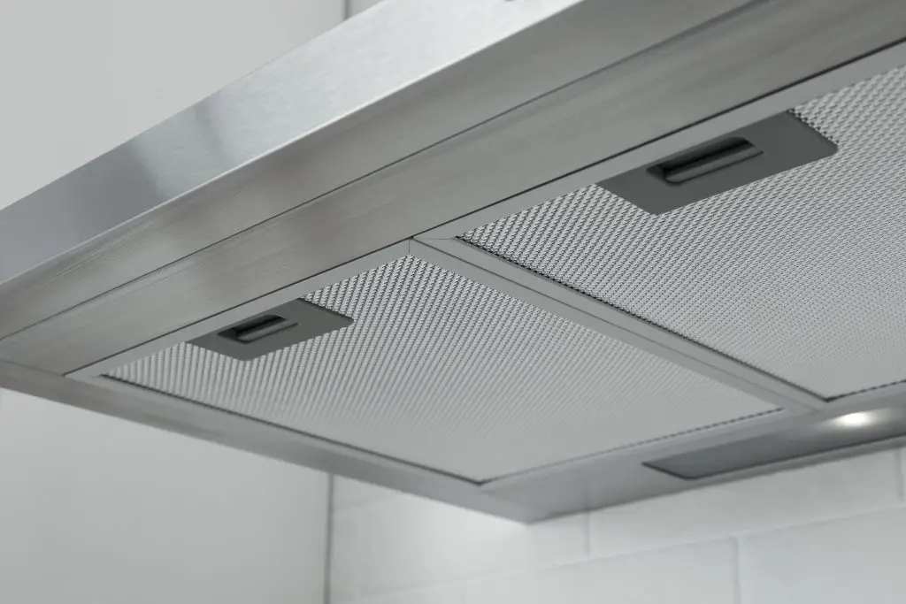 Image of a recirculating ductless under cabinet range hood. Source: Adobe Stock