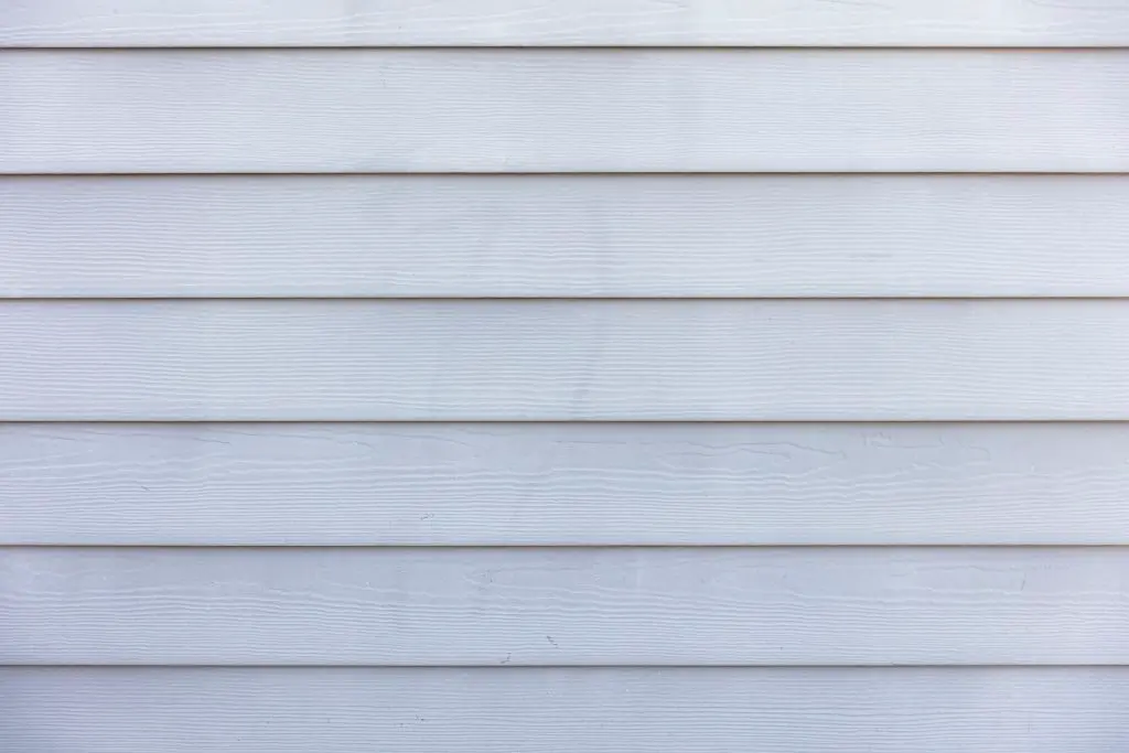Image of vinyl siding on the exterior wall of a home. Source: jon moore, unsplash